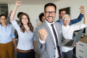 image showing employees celebrating after reviewing browning associates client testimonials